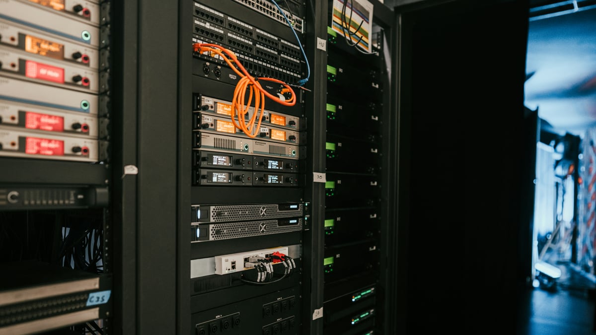 a rack of servers in a server room
